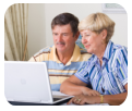 senior couple using a laptop
